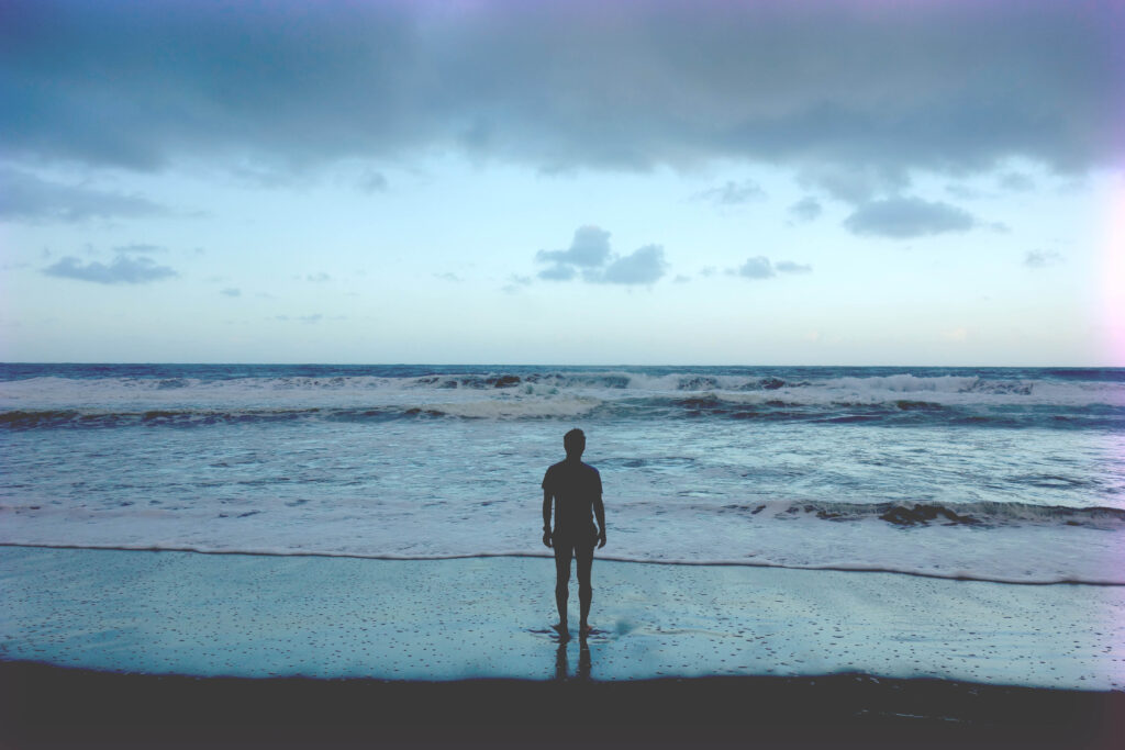 Person standing in waves